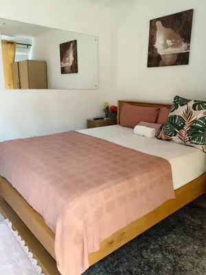 a bedroom with a large bed in a room at EasyStay Hideaway in Pretoria