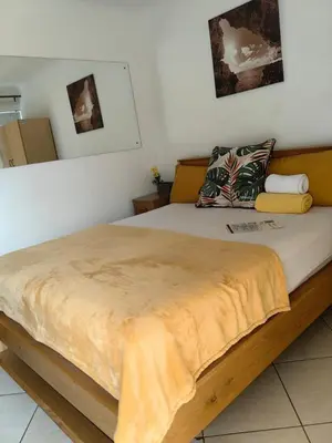 a bedroom with a large bed in a room at EasyStay Hideaway in Pretoria