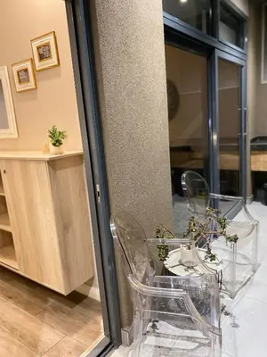 a room with two chairs and a table at Menlyn Maine Luxury Apartment in Pretoria