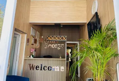 a welcome sign on the side of a building at Henry George Hotel in Pretoria