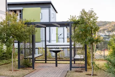 a gazebo in front of a house with trees at Chawal Stays Green Valley 1 in Nelspruit