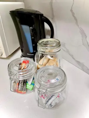 a counter with jars of food and a coffee pot at Little Swift 1 in Secunda