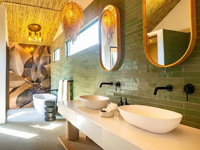 a bathroom with two sinks and two mirrors at 18 On The Hill in Mica
