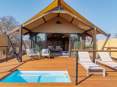 a gazebo with chairs and a pool at 18 On The Hill in Mica