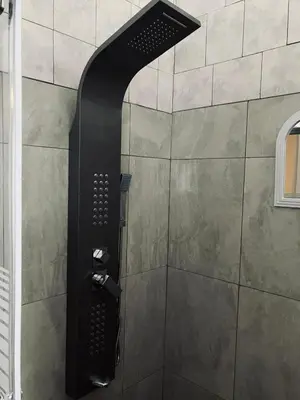 a shower with a black shower head at Willow Cottage in Evander