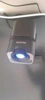 a light hanging from the ceiling of a toilet at Cozy in Centurion