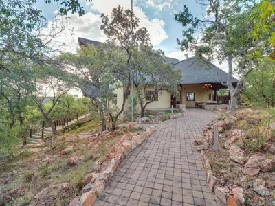 a brick walkway in front of a building at 210 Zebula, 5-bedroom villa in Warmbaths