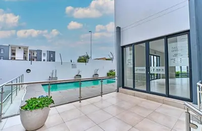 a swimming pool on top of a building at Unit 235 at 50 On Lever in Midrand