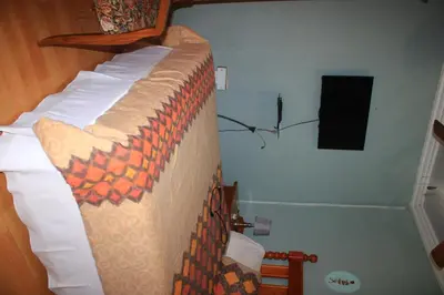 a bedroom with a bed in a room at EvehomeStay B&B in Soshanguve