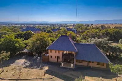 an overhead view of a house in a field at Bush Lodge Retreat Villa 29 in Warmbaths