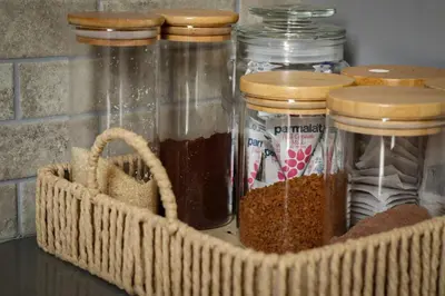 a basket full of jars of spices on a counter at The Grey Oasis in Tzaneen