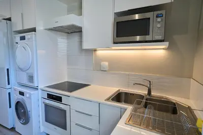 a kitchen with a sink and a microwave at Luxurious Loft in Pretoria