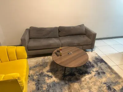 a living room with a couch and a coffee table at The Parks in Midrand