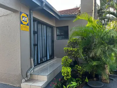a house with a sign on the side of it at Guesthouse at 543 in Lebowakgomo