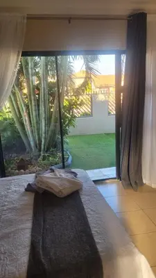 a bedroom with a bed and a large window at Guesthouse at 543 in Lebowakgomo