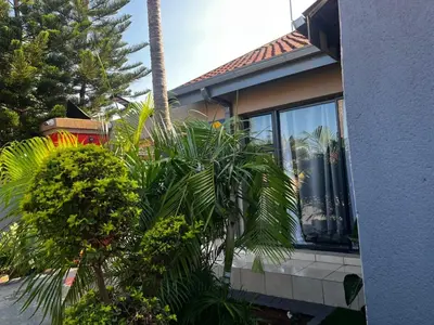 a house with plants in front of a window at Guesthouse at 543 in Lebowakgomo