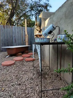 a grill on a table next to a fence at Ukulala Inn in Malelane