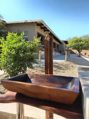 a wooden boat sitting on top of a table at Ukulala Inn in Malelane