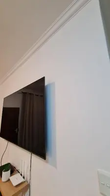 a flat screen tv hanging on a wall at NO LOADSHEDDING 1 Bedroom Apartment in Trichardt