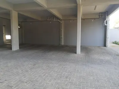 a large empty room with two columns in a building at Junction 502, Menlo Park in Pretoria
