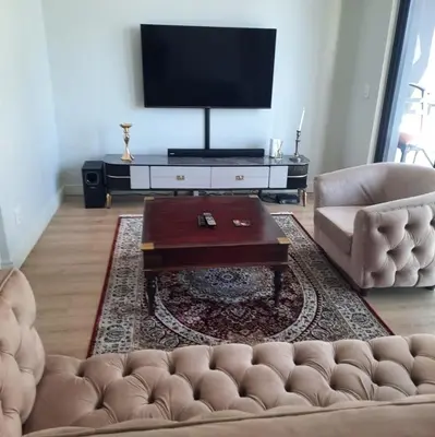 a living room with a couch and a coffee table at Luxury Penthouse Apartment Waterfall Midrand in Midrand