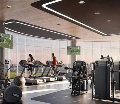 a gym with two women running on tread machines at Luxury Penthouse Apartment Waterfall Midrand in Midrand