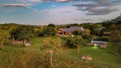 an aerial view of a house with a yard at Kambaku River Lodge in Malelane