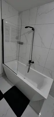 a glass shower in a bathroom with a white counter at 66 On RN in Midrand