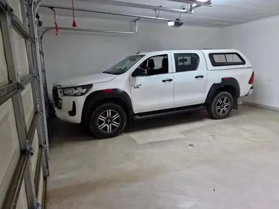a white truck parked in a garage at Tusker House Kruger in Marloth Park