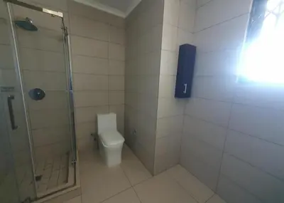 a bathroom with a shower and a toilet at Luxury Apartment At Erand Gardens Midrand in Midrand