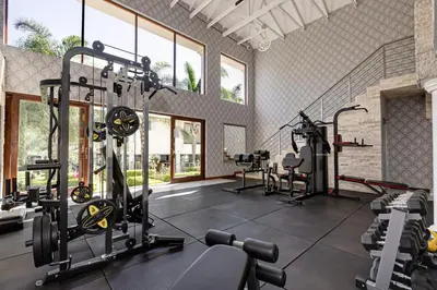 a gym with treadmills and machines in a room at Concordia Boutique Venue in Midrand