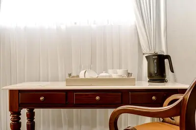 a wooden table with a counter top with a window at Concordia Boutique Venue in Midrand