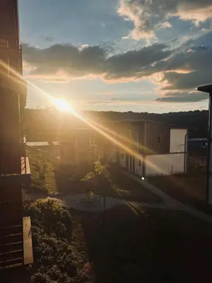 a view of the sun setting over a building at Luxury Apartment in Mbombela, Nelspruit Mpumalanga in Boschrand
