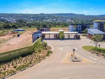a building with a sign in the middle of a street at Luxury Apartment in Mbombela, Nelspruit Mpumalanga in Boschrand
