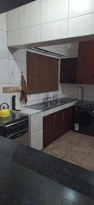 a kitchen with a sink and a stove at Chrysantimum Guest Apartment in Thabazimbi