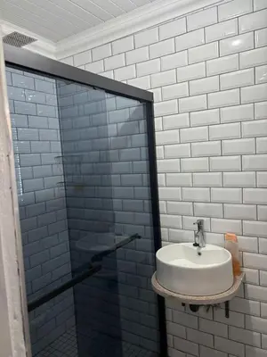 a bathroom with a sink and a glass shower at The Secret Location in Pretoria