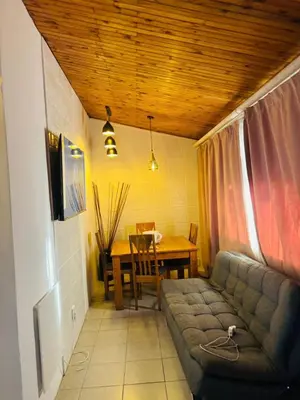 a living room with a couch and a table at The Secret Location in Pretoria