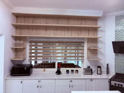 a kitchen with a counter top with a window at Pecanwood Villa with lake view in Hartbeespoort