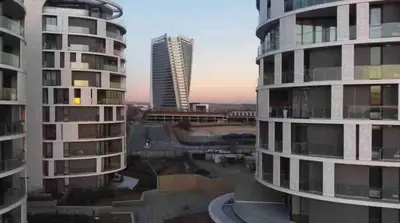 two tall buildings in a city next to each other at Explore Ellipse - Emerald Studio in Midrand