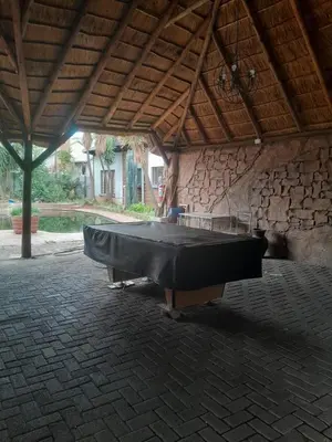 a ping pong table in a pavilion with at Twala trails lodge in Midrand