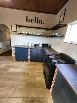 a kitchen with a stove and a counter top at Ode to Tranquility House - Pax 6 in Pretoria