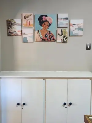 a room with white cabinets with pictures on the wall at Ode to Tranquility House - Pax 6 in Pretoria