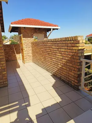 a brick retaining wall with a patio at Centurion villa in Centurion