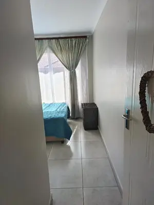 a bedroom with a window and a bed in a room at Centurion villa in Centurion
