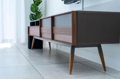 a wooden dresser sitting on top of a tile floor at Homeaway in Midrand