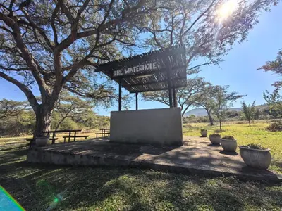 a sign that says the marriott sign in a park at Klugro Cottage in Nelspruit
