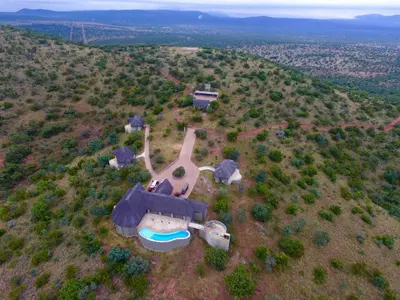an aerial view of a house on a hill at RoiSan Private Game Lodge in Rooiberg