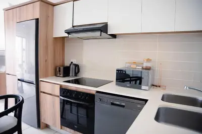 a kitchen with a sink and a stove top oven at regal retreat in the blyde in Pretoria