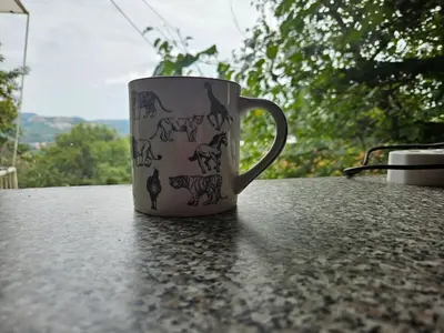 a coffee cup sitting on top of a table at Cottage of the Grumpy Old Man, no loadshedding in Pretoria