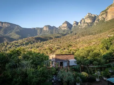 a house with a mountain in the background at 59 Kiepersol in Kampersrus AH